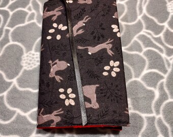 Adjustable Book Cover with Bunnies, rabbits.  Fits Mass Market Paperbacks.  Red flannel lined.