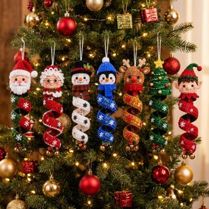 May include: Seven crocheted Christmas ornaments hanging in a row, each featuring a character head atop a spiral body. Characters include Santa, Mrs. Claus, a snowman, a penguin, a reindeer, a Christmas tree, and an elf, all with festive details.