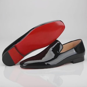 Christian Louboutin  Black Loafers are Italian Crafted from Glossy Patent Leather with Red Sole