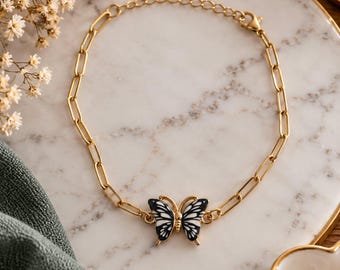 Black and white butterfly bracelet, gold-tone stainless steel chain, elegant costume jewelry, gift idea for women
