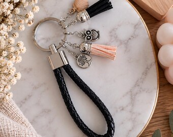 Black braided keychain with tassels and silver charms, elegant bag accessory, original gift idea