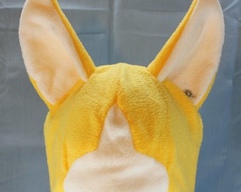 May include: Yellow fleece hat with large, floppy ears. The hat is designed to look like a fox or other animal with large ears.
