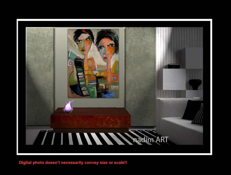 May include: Abstract painting of two women with colorful geometric shapes and patterns. The painting is framed and hanging on a wall in a modern living room setting. The painting is signed "nadim ART".