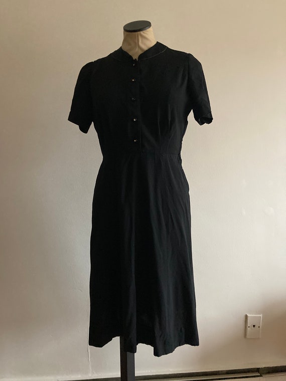 vintage 1950s black fit and flare dress