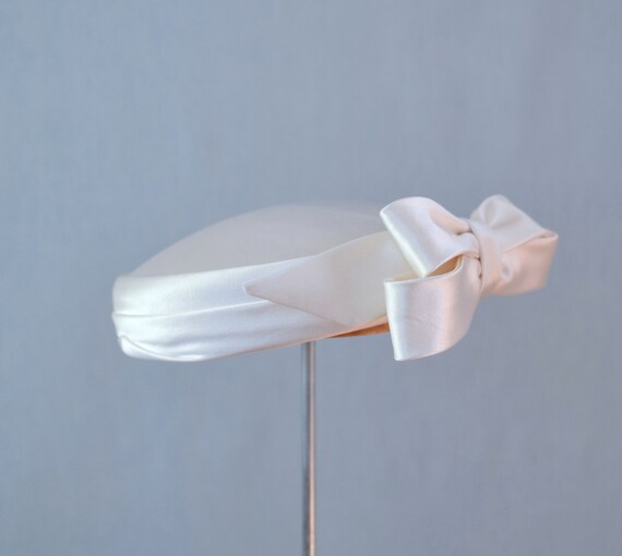 White satin pillbox hat with decorative bow detail Bridal Pillbox Hat with Veil and Bow - ALENA main image 3