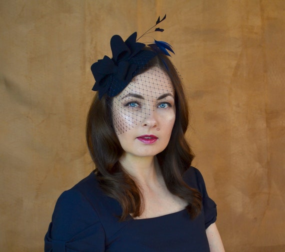 what colour fascinator with navy blue dress Full length dress with pearl waistband. 70696L