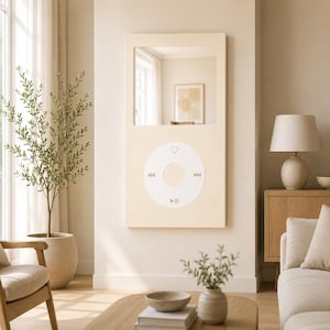 May include: A rectangular wall mirror featuring a light beige frame designed to resemble a classic digital music player. The upper section is a reflective glass mirror, while the lower section displays a circular control interface with icons.