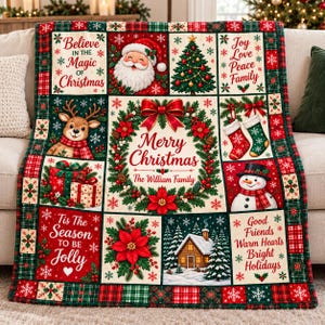 May include: A rectangular Christmas-themed throw blanket featuring a patchwork design with red, green, and white colors. Panels display Santa Claus, a reindeer, a Christmas tree, stockings, a snowman, a cabin, and text including Merry Christmas.