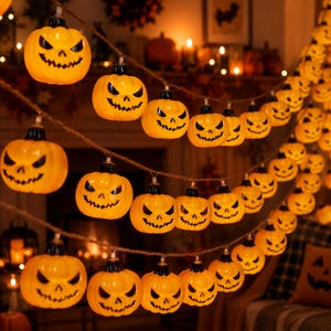 May include: A string of orange jack-o'-lantern lights featuring carved faces with triangular eyes and jagged mouths. The plastic pumpkin-shaped bulbs are attached to a brown twisted cord, creating a festive Halloween decoration.