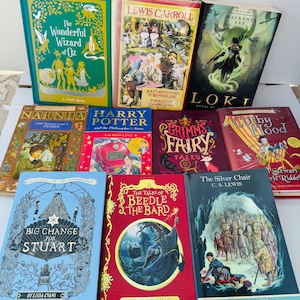 May include: A collection of nine hardcover and paperback books featuring various fantasy titles including The Wonderful Wizard of Oz, Alice's Adventures in Wonderland, Loki, The Magician's Nephew, Harry Potter, Grimms Fairy Tales, Corby Flood, Big Change for Stuart, The Tales of Beedle the Bard, and The Silver Chair.
