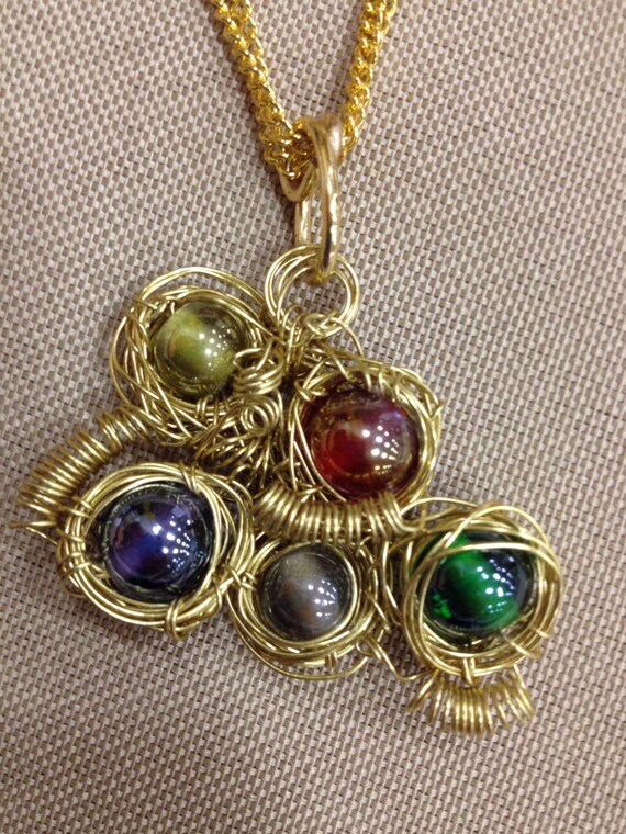 Items similar to Gold wire wrapped necklace on Etsy