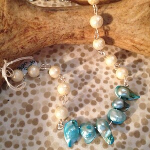 Turquoise blister pearls with round Ivory pearls