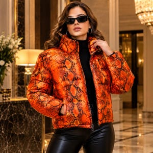 Women's Orange Snake Print Puffer Jacket, Oversized Winter Coat, Quilted Jacket, Stylish Streetwear.
