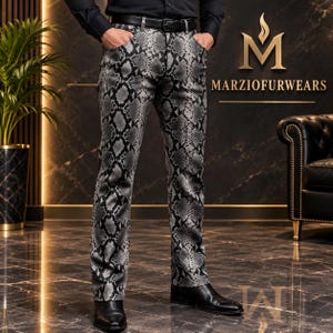 May include: Trousers featuring a grey and black snakeskin pattern, designed with a standard waistband, belt loops, and a classic five-pocket construction. The pants are paired with a black belt and black leather shoes, showcasing a fitted cut.