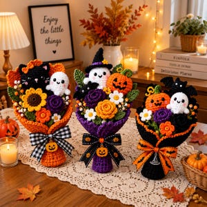 May include: Three handmade crochet bouquets featuring Halloween-themed figures including black cats, white ghosts, orange jack-o'-lanterns, and bats, accented with crocheted flowers, leaves, and decorative ribbons with pumpkin and witch hat charms.