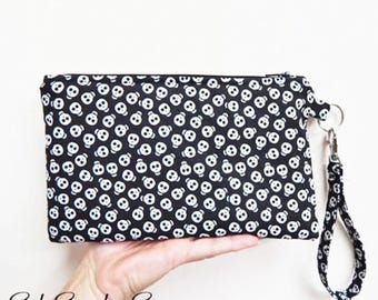 Glow in the Dark Skulls Smartphone Clutch: Wristlet Purse, 9 x 5.5 inches, Fits iPhone 17 Pro, Galaxy S24, Zipper Closure, Inside Pockets