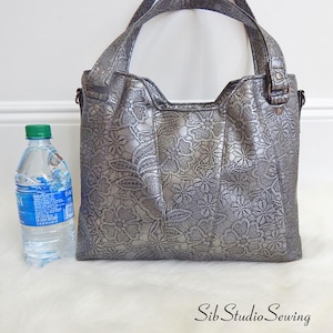 Pewter Lace Shoulder Bag: Metallic Vinyl Crossbody Handbag, 13 x 10.5 x 5 inches, Zipper Closure, Removable Crossbody Strap, Pockets