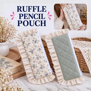May include: Two rectangular pencil pouches with white ruffled fabric borders and white zippers. One pouch features a cream fabric with a blue floral pattern, while the other is solid sage green. Both have a quilted diamond-stitched texture.