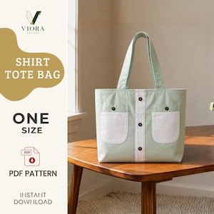 May include: A light green tote bag featuring a central white vertical panel with three dark buttons, two white patch pockets with button closures, and two shoulder straps. The text reads VIORA PATTERN SHIRT TOTE BAG ONE SIZE PDF PATTERN.