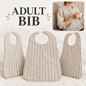 May include: Three adult bibs featuring a beige and white vertical striped pattern with a quilted texture. Each bib has a rounded neckline and a hook-and-loop closure at the top. The text ADULT BIB is displayed in dark green letters above the items.