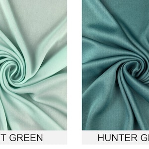 May include: Two fabric swatches, one in a light mint green color and the other in a darker hunter green color. Both swatches are folded and twisted to show the texture of the fabric.