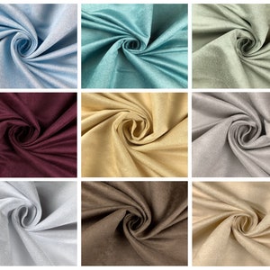 May include: A collection of nine swatches of fabric in various colors, including light blue, teal, sage green, burgundy, gold, silver, gray, brown, and beige. Each swatch is arranged in a spiral pattern, showcasing the texture and color variations.