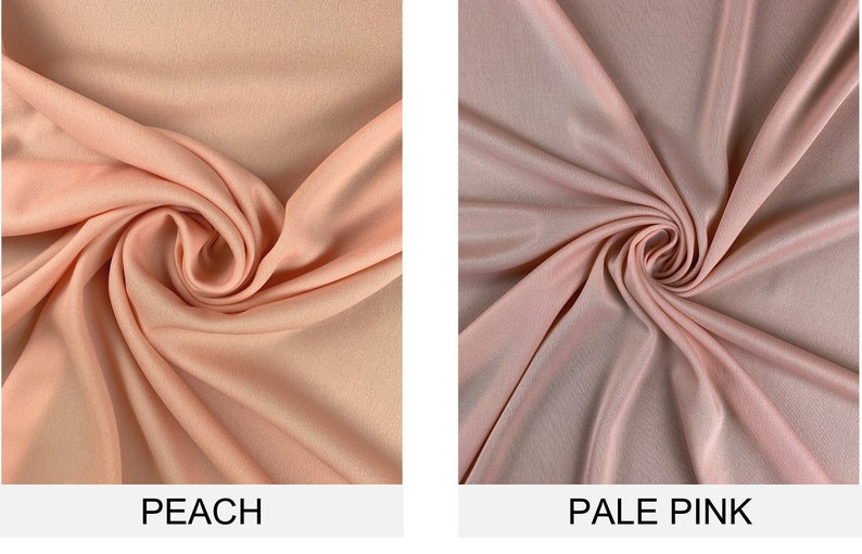 May include: Two fabric swatches, one peach and one pale pink, are shown in a close-up view. The fabric is draped and folded to show its texture.