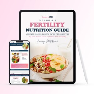 May include: A digital tablet and smartphone displaying The Complete Fertility Nutrition Guide. The screen shows text about egg quality, hormone balance, and IVF nutrition, alongside a bowl of fruit and seeds and a white stylus pen.