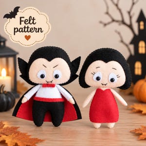 May include: Two handmade felt dolls representing vampires. The left doll wears a black cape with a red lining, a white shirt, and black pants. The right doll wears a red dress. Both have black hair, pale skin, and fangs. Text reads: Felt pattern.