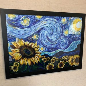 May include: A rectangular framed painting featuring a large yellow sunflower in the foreground against a dark blue swirling night sky filled with yellow stars and a crescent moon. Smaller sunflowers are scattered across the bottom of the canvas.