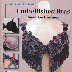 May include: A book titled "Embellished Bras: basic techniques" by Dawn Devine Brown with photography by Barry Brown. The cover features a close-up of a black bra embellished with purple and green beads and fringe.