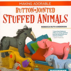 May include: Book cover titled "Making Adorable Button-Jointed Stuffed Animals" featuring various stuffed animal toys. The toys include a gray horse, pink pig, yellow dog, gray chicken, and blue lamb. The book includes 20 step-by-step patterns.