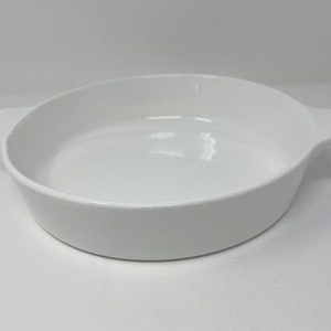 May include: White ceramic baking dish with two handles.