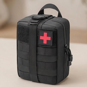 May include: A black tactical medical pouch featuring a red cross patch on the front. The bag includes a top carry handle, a vertical strap with a plastic buckle, multiple horizontal webbing rows, and a side zipper closure with cord pulls.