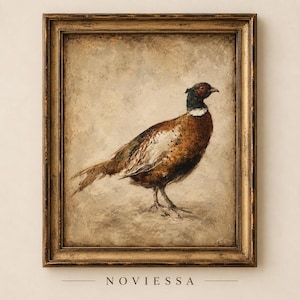 Puede incluir: Una lámina de arte enmarcada que muestra la pintura de un faisán con plumaje marrón, dorado y verde oscuro. El ave aparece de perfil sobre un fondo texturizado de tonos neutros. La obra está contenida en un marco dorado de estilo antiguo.