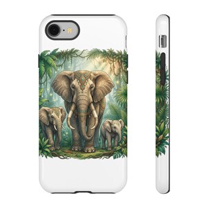 May include: A white smartphone case featuring a detailed illustration of a large adult elephant standing between two smaller elephants in a lush green jungle setting. The elephants have intricate decorative patterns on their skin and tusks.