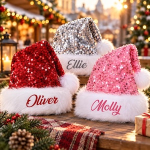 May include: Three holiday hats featuring sequined fabric in red, silver, and pink. Each hat has a white faux fur trim and a white pom-pom. The red hat is personalized with the name Oliver, the silver hat with Ellie, and the pink hat with Molly.