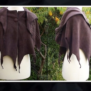 May include: A brown hooded cape with a button fastening and a jagged, leaf-like hem.