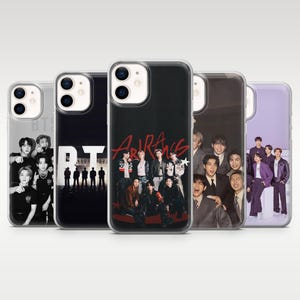 May include: Five clear smartphone cases featuring various BTS group photographs and graphics. The designs include black and white portraits, silhouettes against a bright background, red text, and full-color images of the seven members in formal attire.