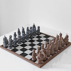 May include: A chess set featuring a square board with a black and white checkered pattern and a brown frame. The game includes two sets of molded character figurines, one in a matte gray finish and the other in a solid light brown finish.