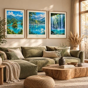 May include: Three framed wall art prints featuring vibrant Japanese landscapes. The left print shows a bridge over turquoise water, the centre depicts a forest lake, and the right displays a waterfall. Each print includes the text 日本 JAPAN.