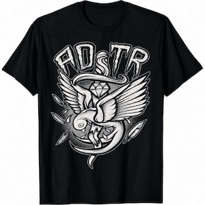 May include: A black short-sleeve t-shirt featuring a white graphic print of a bird with spread wings wrapped around a dagger. Above the bird is a diamond shape and the text AD TR in a stylized font. Several feathers are scattered around the central design.