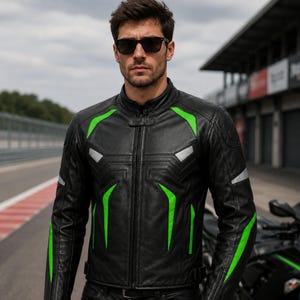 May include: A black leather motorcycle jacket featuring vibrant green angular accents on the chest and sleeves, a high collar with a snap closure, a central zipper, and silver reflective panels positioned on the upper chest and outer arms.