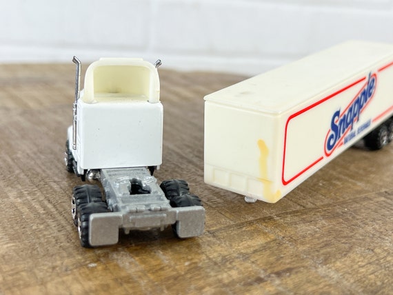 1987 Vintage Road Champs White Kenworth Semi Truck With Trailer