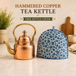 May include: A hammered copper tea kettle with a gold-toned handle and spout, accompanied by a dome-shaped fabric tea cozy featuring a blue and green floral pattern. The text HAMMERED COPPER TEA KETTLE and FREE KETTLE COVER is visible above.