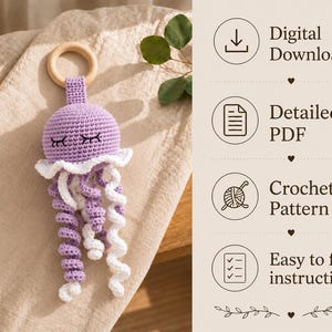 May include: A purple and white crocheted jellyfish toy attached to a round wooden ring. The text on the right reads: Digital Download, Detailed PDF, Crochet Pattern, Easy to follow instructions. The jellyfish has embroidered closed eyes.