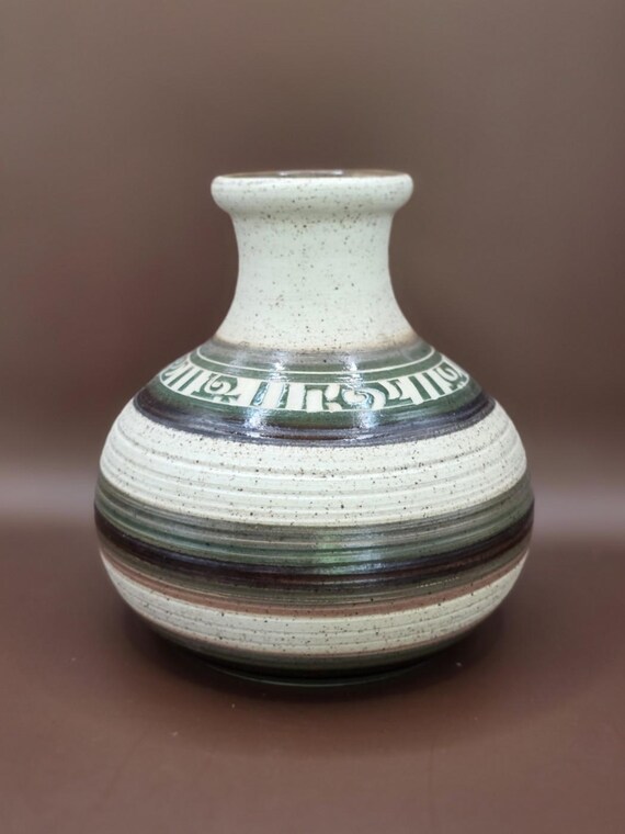 A signed, one-of-a-kind stoneware bud vase thrown by an actual studio potter — the kind of piece that looks like it was sourced from a European flea market, not a big-box store.
