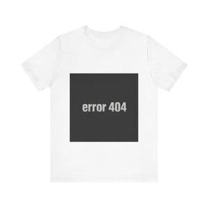 May include: A white short-sleeved t-shirt featuring a large, centred black square graphic on the chest. Inside the black square, the text "error 404" is printed in a light grey, distressed, sans-serif font, creating a high-contrast visual design.