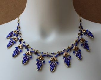 Bead woven glass statement necklace in sapphire blue and rich gold, adjustable, handmade, exotic, unique