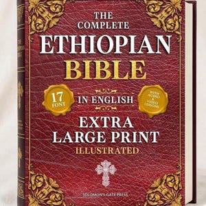 May include: A hardcover book titled The Complete Ethiopian Bible in English with extra large print. The cover is deep red with a textured leather-like finish, gold ornate corner accents, and two gold circular seals mentioning 17 font and audio.